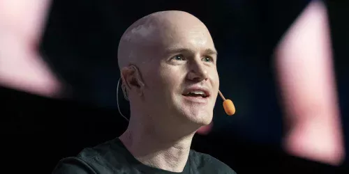 Coinbase demite 14% e revela o futuro do trabalho: equipes de 1 pessoa e fim dos chefes